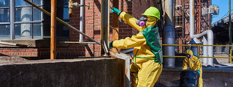 refinery worker in chemical protective suit