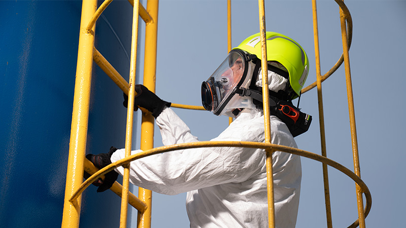 Worker on a ladder wearing CleanSpace respiratory protection